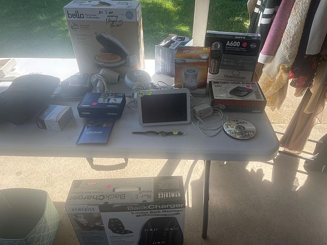 Yard sale with a lot of stuff photo
